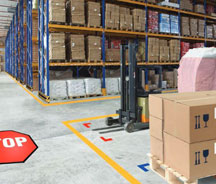 Busy warehouse with storage areas and defined forklift lanes