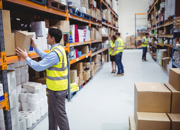 warehouse worker picking from a storage rack