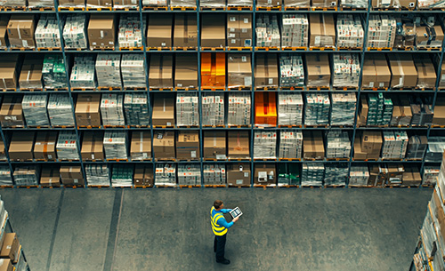 worker performing inventory with a tablet device