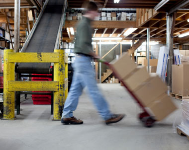 warehouse worker walking in an industrial plant