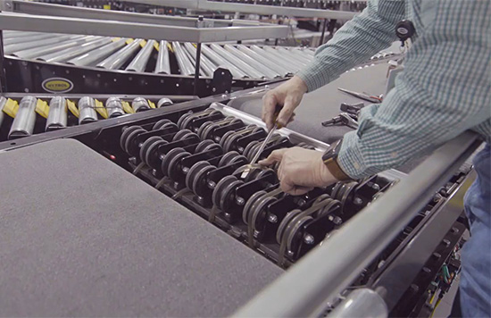 worker changing o-rings on a belt conveyor