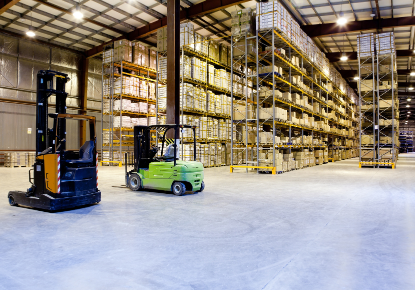 Large modern warehouse with forklifts