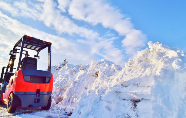 forklift in a snowy lot