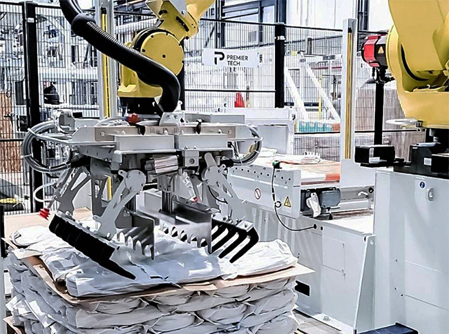 robot placing bags on pallet