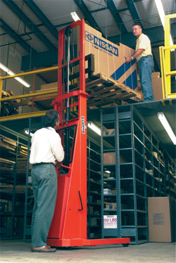 stacker used to elevate pallet to a mezzanine