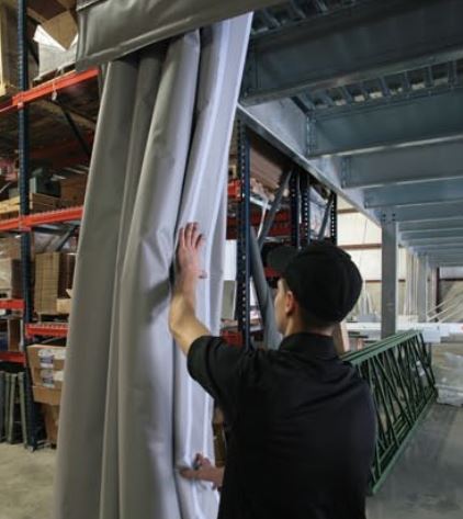 curtain wall being adjusted in a warehouse