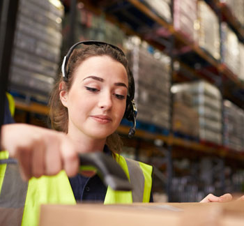 warehouse worker with a bar code scanning gun.