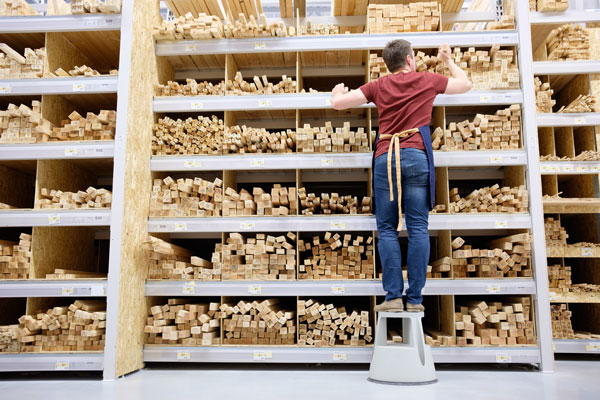 picking wood and boards from a warehouse rack