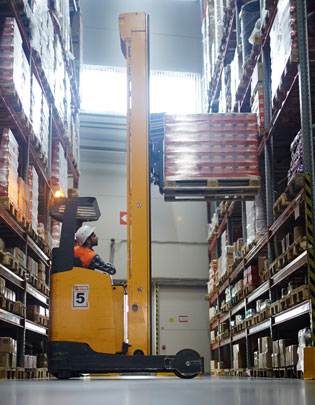 pallet rack being loaded with a rack truck