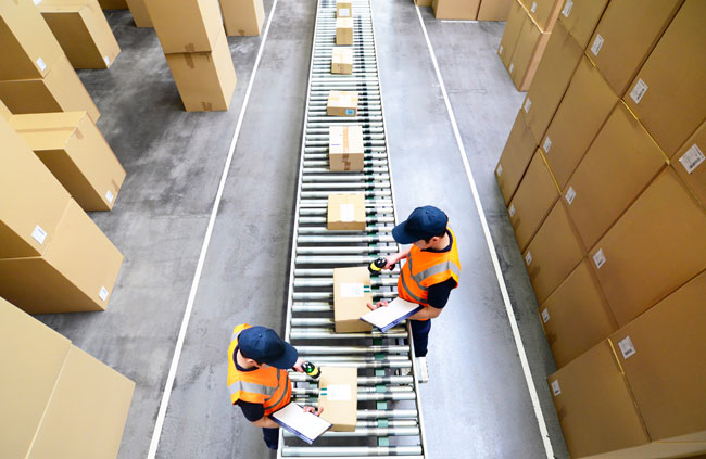 warehouse workers with cartons