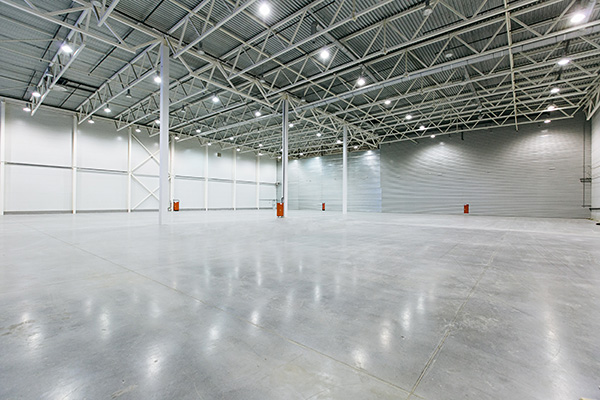 empty warehouse with girders and columns