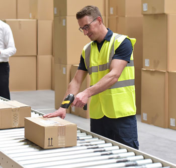 Scanning an order on the conveyor line with a hand-held RF scanner