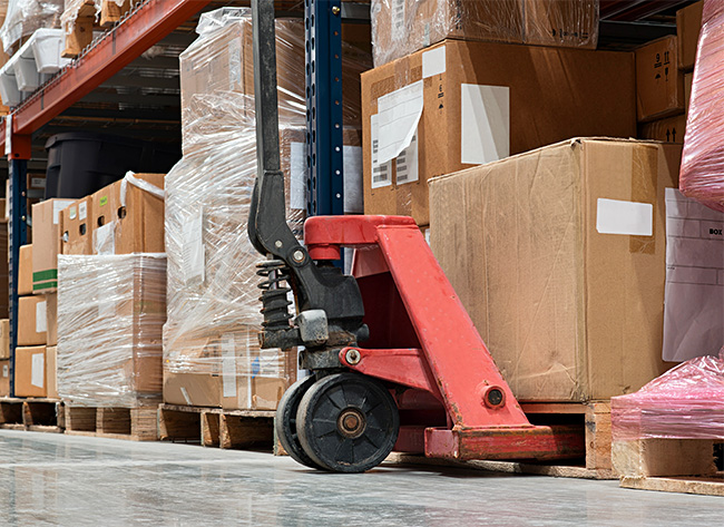 pallet jack picking pallet from floor 