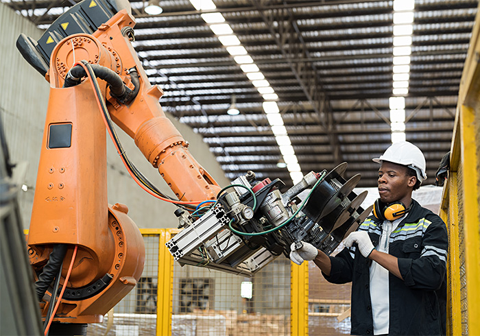 worker using industrial robot