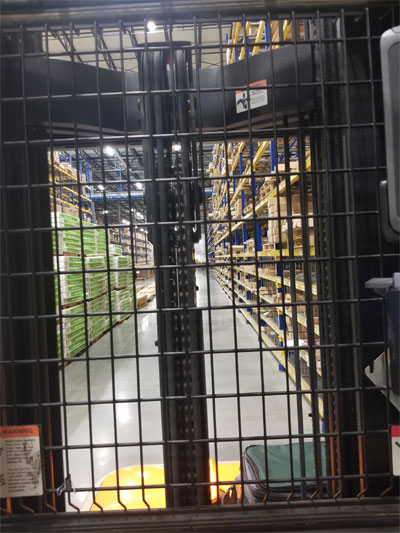 Order picker with guard obstructing visibility