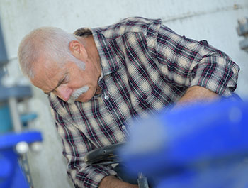 elderly worker in a factory