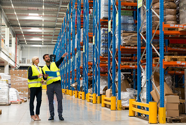 Warehouse racks in a layout, with consultants walking through