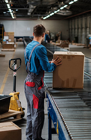 warehouse order picking cartons off a conveyor system