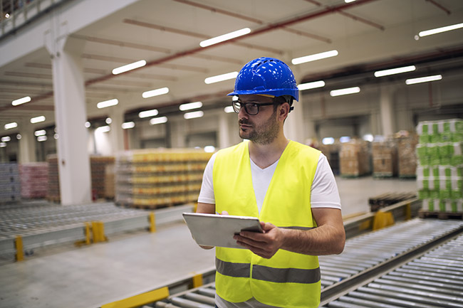 warehouse being audited by a manager