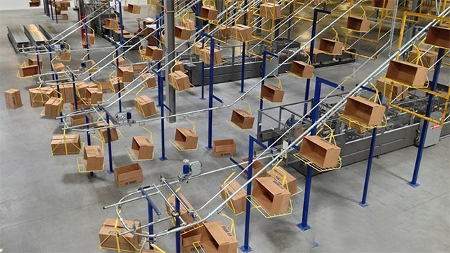 overhead conveyor transporting empty boxes