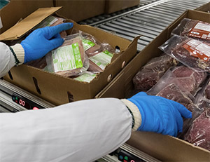 Picking from carton flow in a food distribution center