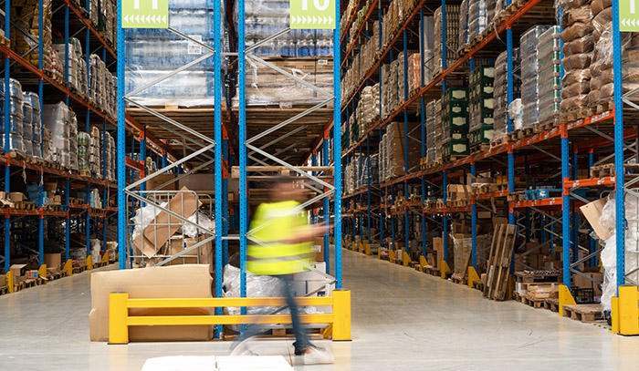 warehouse rack and worker in aisle