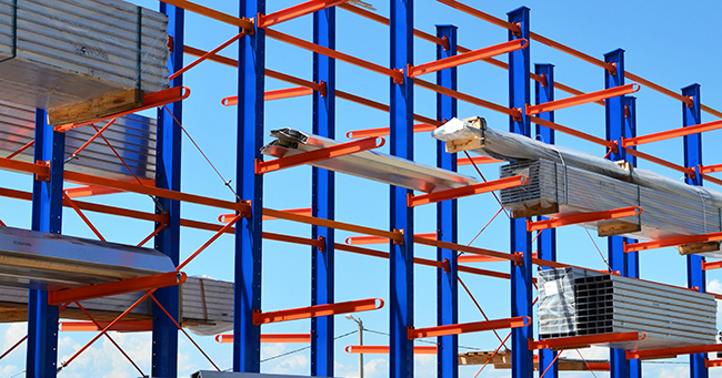 cantilever rack system storing lumber and tubing, outdoor application