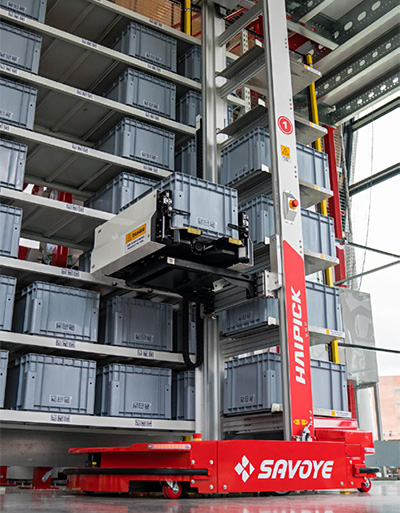 robot accessing containers in a storage system