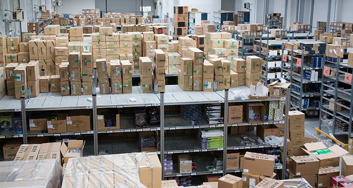 High density warehouse shelving system with carton and each pick storage.