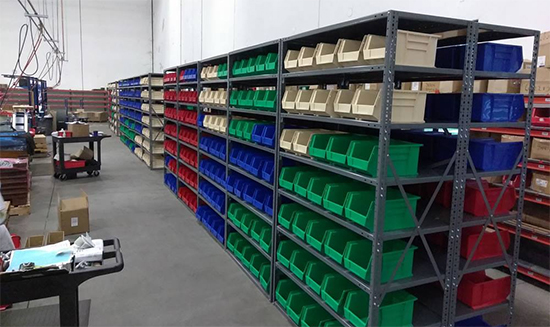 Shelving system with storage bins.