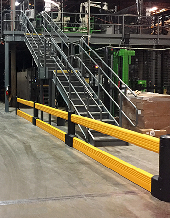 Guardrails surrounding a conveyor system.