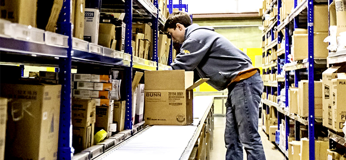 Automated packing area for an ecommerce distribution center, pick-to-cartons operation.