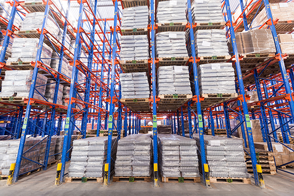 Drive-in pallet rack system in a distribution center.