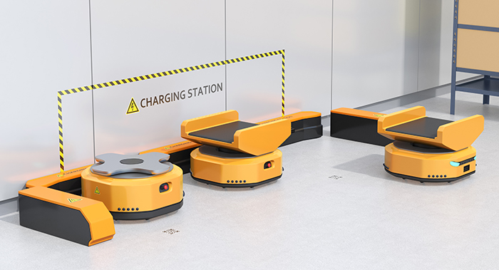 Autonomous Mobile Robots charging at a warehouse area.