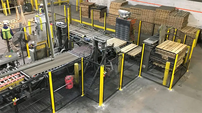 machine guard installed around a conveyor system in a manufacturing facility