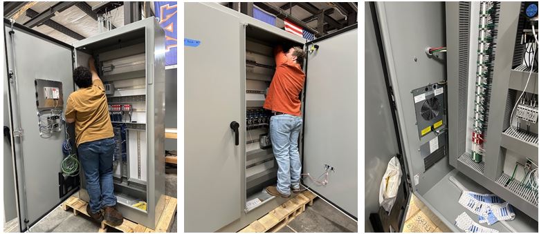 Systems Technology Group assembling panels for conveyor control system