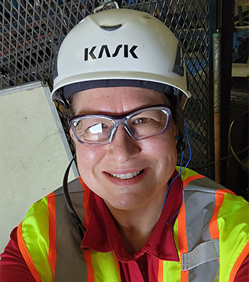 award winner in hard hat, safety glasses and safety vest