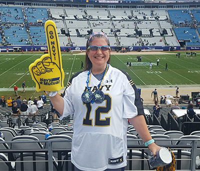 Christine Perry attending Navy football game