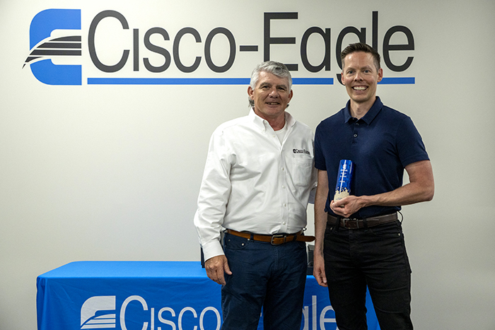 Evan accepts award from James Murphy