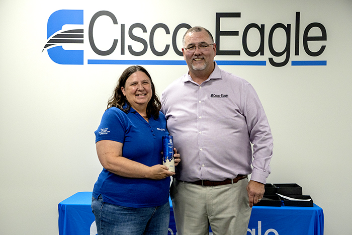 Lori accepts team player award from Bryan Gauger