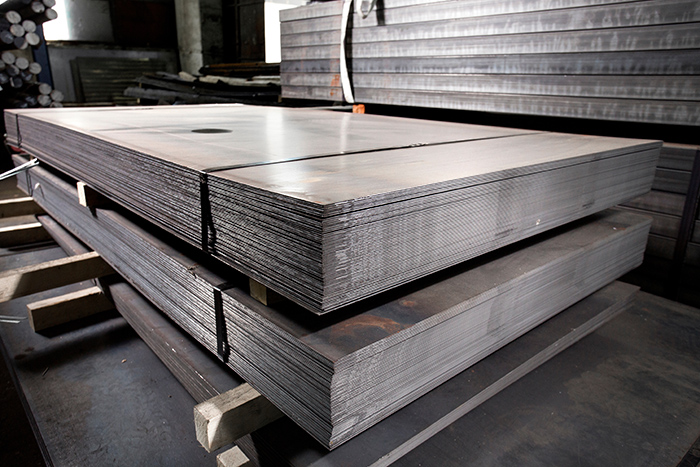 Sheet metals stacked in a manufacturing facility.