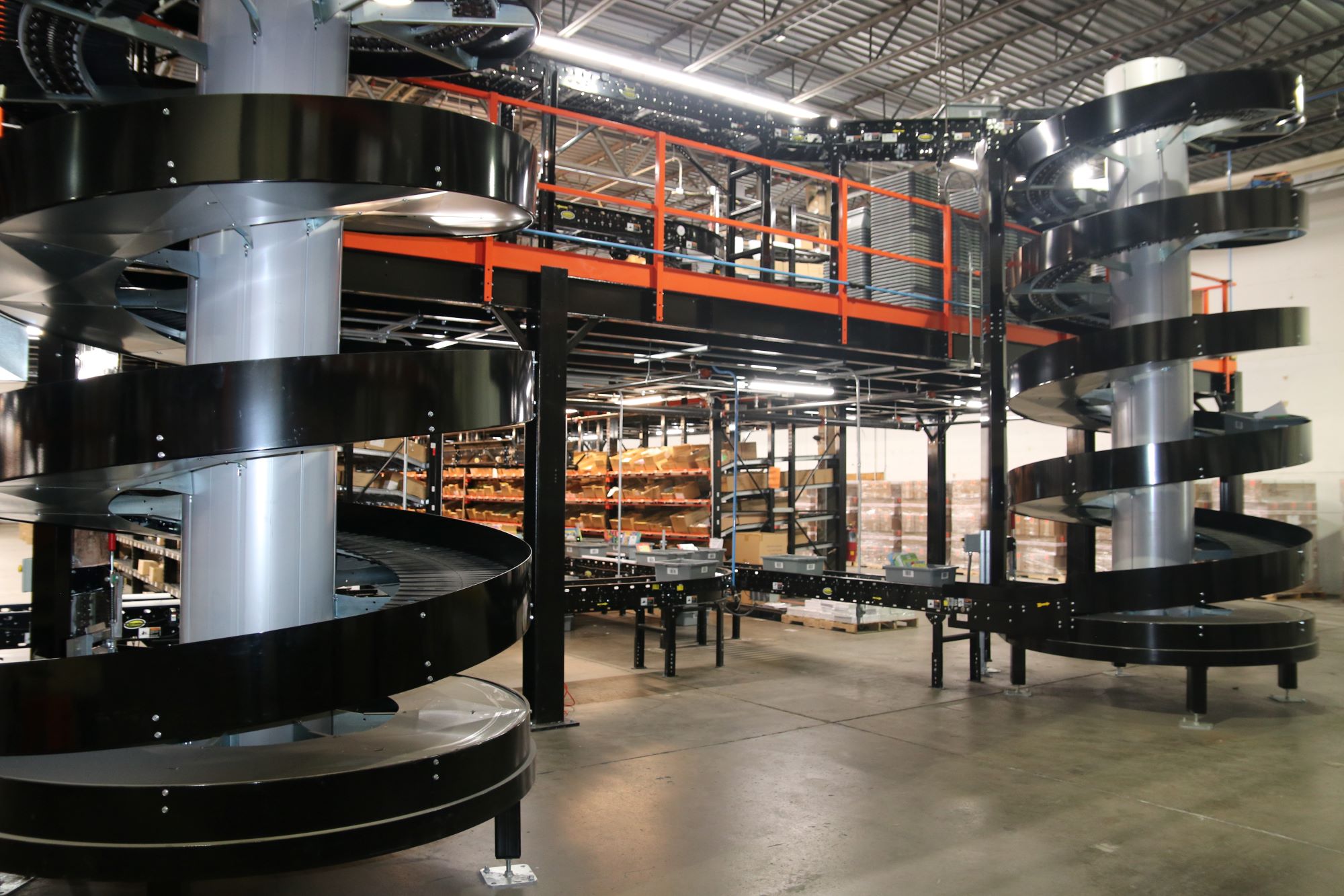 Mezzanine and pick module with conveyor