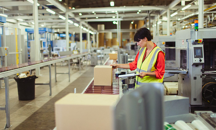 Warehouse production line with a conveyor and order picker