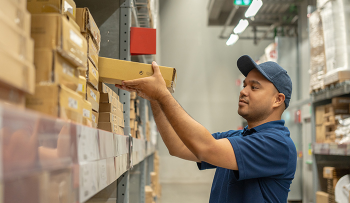 Order picking cartons from static shelving positions